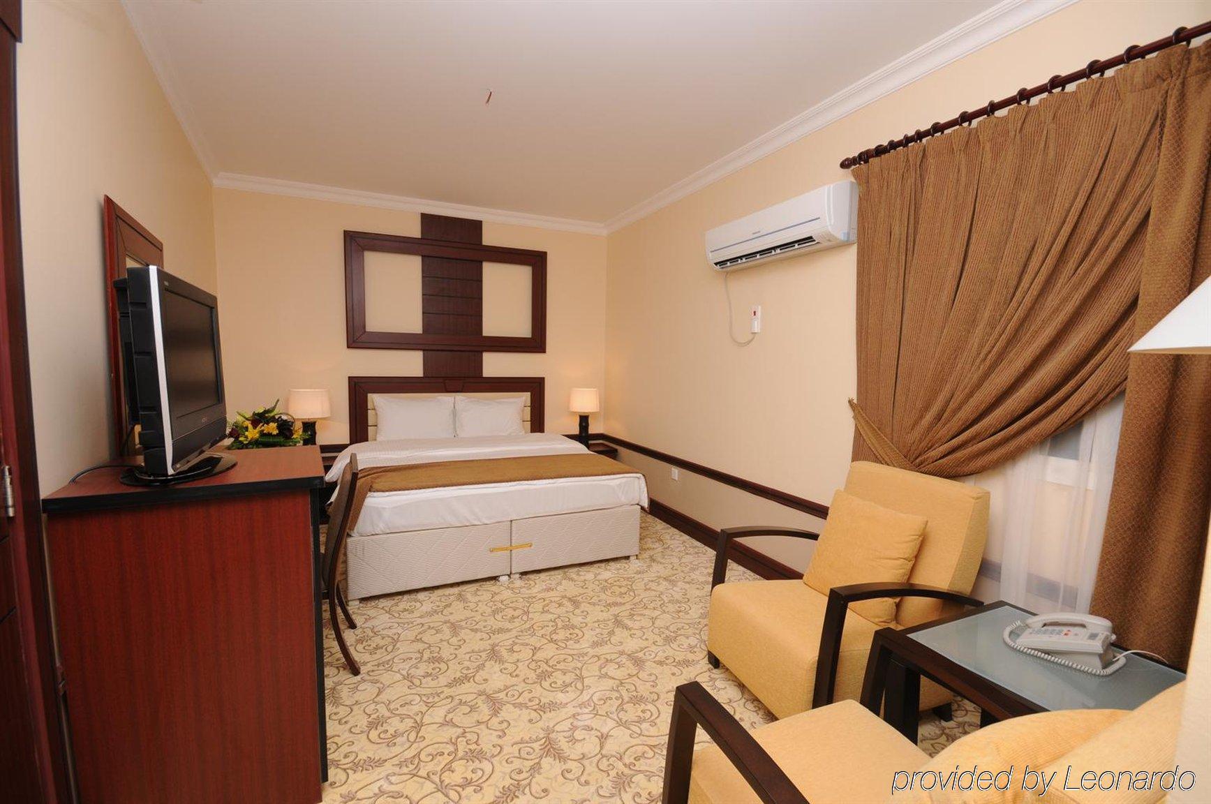 La Villa Palace Hotel Доха Стая снимка